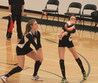 Leah Holthaus makes a pass during the Kendrick Tournament as Tanna Schlader was ready in case Holthaus missed it.