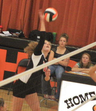 Tanna Schlader spikes the ball during the Kendrick Tournament.