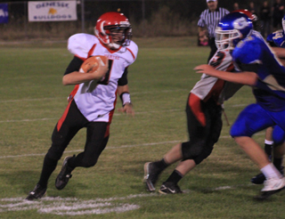 Lucas Arnzen cuts past a block made by Garrett Schmidt as he looks to gain yardage against Genesee.