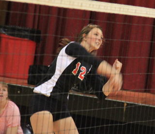 Tyler Workmans face shows the effort she put into this spike against Grangeville.