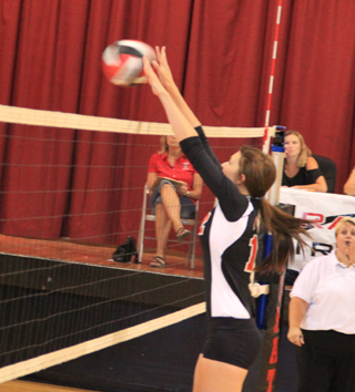 Tyler Workman makes a block against Potlatch.