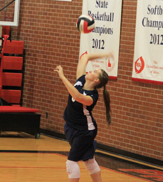 Summits Rachael Frei powers into a serve in the match against Kendrick.