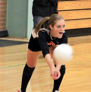 Tanna Schlader makes a pass against Asotin at the Border Battle tournament.