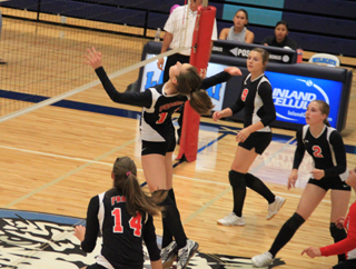 Krystin Uhlenkott goes for a spike against Lapwai as from left Shelby VonBargen, Brooke Schumacher, Hailey Danly and at the edge of the photo, Stephanie Gimmeson watch.