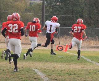 Lucas Arnzen leaves a trail of C.V. defenders in his wake as he scores a touchdown.