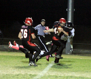 Kade Perrin gains yardage after a catch against Lakeside. Also shown is Frank Spencer, 76.