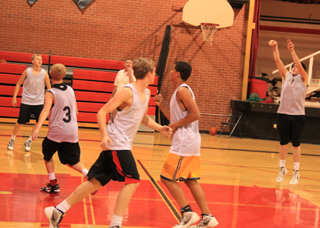 The PHS boys team runs a drill during practice last week. Shooting at right is Seth Chaffee with other players from right being Marcus Higgins, Rhett Schlader, Lucas Arnzen and Tyler Hankerson. In the background is head coach Teel Bruner.