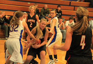 It was a physical game at Nezperce as Kayla Schumacher tries to maintain possession of the ball. In the background is Callie Mader and at right is Tanna Schlader.