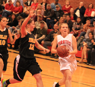 Keely Schmidt goes for a lay-up after having stolen the ball on the other end.