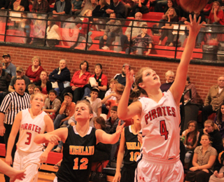 Tanna Schlader got inside for a lay-up in last Tuesdays game against Highland. At left is Keely Schmidt.