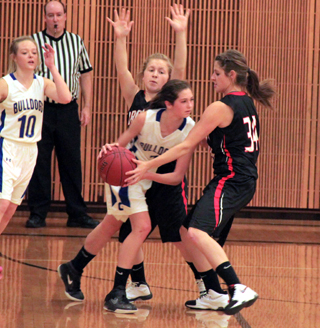 Nicole Wemhoff and Shelby VonBargen doubleteam the ball in the Genesee game.