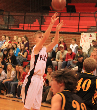 Rhett Schlader puts up a perimeter shot in the Highland game.