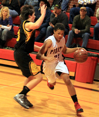 Tyler Hankerson drives the baseline against Highland.