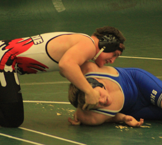 Garrett Schmidt works over Roy Compton of Colfax on his way to a win by pin. Results from the Potlatch tournament will be in next week's update.