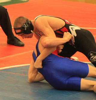 Hunter McWilliams works to turn the shoulders of Orofinos Tyler Schwartz.