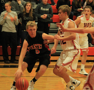 Marcus Higgins drives toward the key in the Troy game.