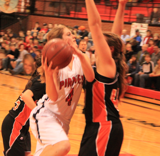 Tanna Schlader goes for 2 of her 22 points against Troy.