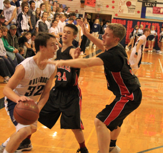 Dylon Bruegeman and Lucas Arnzen double-team the ball in the backcourt against Grangeville.