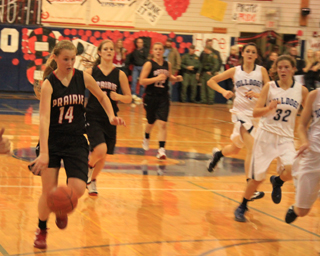 Kayla Schumacher leads a break against Grangeville after making a steal. Also shown are Tanna Schlader and Brooke Schumacher.