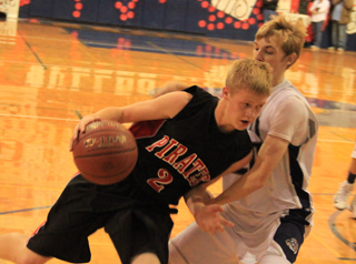 Rhett Schlader works his way towards the hoop against Grangeville.