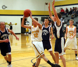 From left Matthew Schwartz, Michael Waters and Josh Lustig surround a Highland ballhandler in the Patriots win at Craigmont.