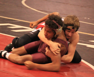 Alex Duman was in control of a Kamiah opponent during the home wrestling meet Dec. 18.