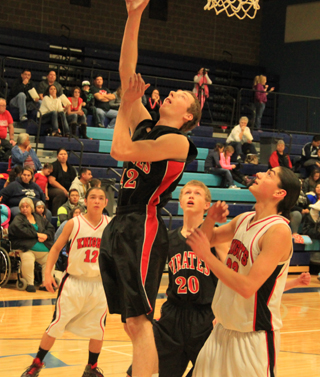 Casey Danly scores against Lakeside as Dan Wemhoff watches.