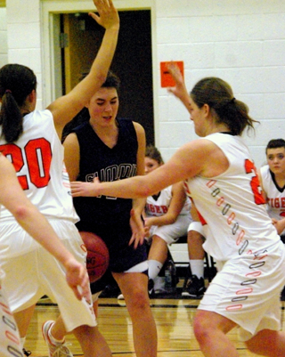 Megan Seubert gets doubleteamed in the Kendrick game. Photo by Rose Frei.