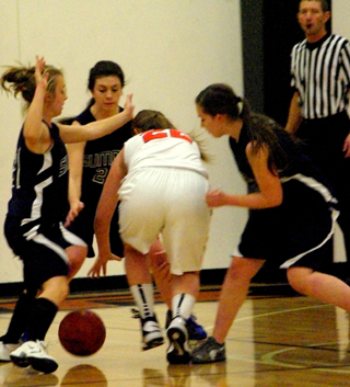 Action from the Summit girls game last week against Kendrick. From left Abi Chmelik, Megan Rehder and Rachael Frei surround a Kendrick player. Photo by Rose Frei.