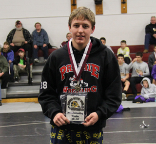 Alex Duman with his plaque as Most Outstanding Wrestler at 145 lbs. and below at the Kamiah Tournament. Photo provided by Pat McWilliams.