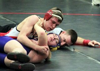 Kade Perrin is about to score a pin against Troy Snyder of Lewiston.