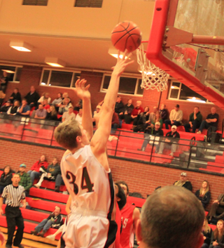 Lucas Arnzen scores 2 of his 24 points against C.V.
