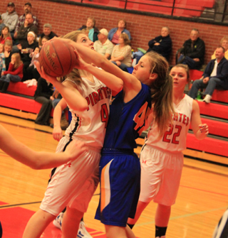Tanna Schlader appears to be getting fouled on this shot attempt against Nezperce as Brooke Schumacher looks on.