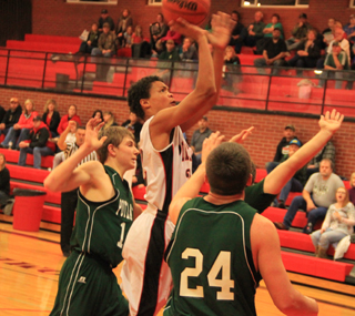 Tyler Hankerson gets in the lane for a shot against Potlatch.