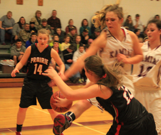 Brooke Schumacher tries to get a pass to her sister Kayla past a Kamiah defender.