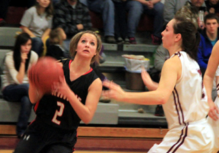 Callie Mader goes for a shot against Kamiah. At right is Bailey Nygaard of Kamiah, daughter of PHS principal Carrie Nygaard.