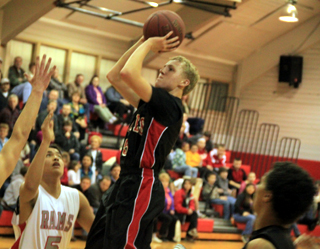 Marcus Higgins gets into the lane for a jump shot against C.V. At bottom right is Tyler Hankerson.