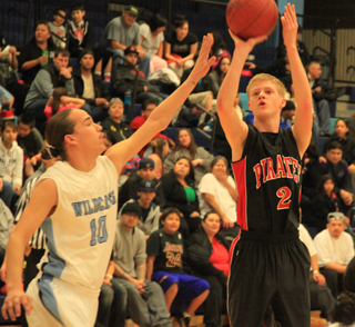Rhett Schlader puts up a jumper at Lapwai as the defender gets there just a tad too late for a block.