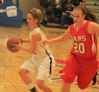 Callie Mader has the ball in the C.V. game. She had a big first half to lead Prairie to a 31-5 halftime lead and a 68-35 win.