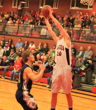 Jake Bruner leaps high for a pass near the Prairie basket.