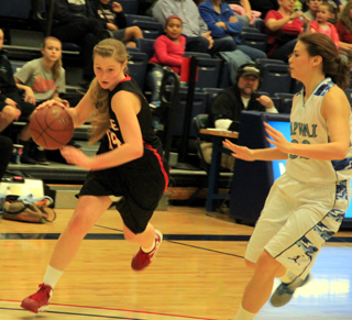 Kayla Schumacher drives downcourt against Lapwai. She had 11 of Prairies 12 first half points in the game.