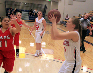 Keely Schmidt sites in a shot against C.V. In the background is Brooke Schumacher who had just made a pass to Schmidt and is hoping to collect an assist.