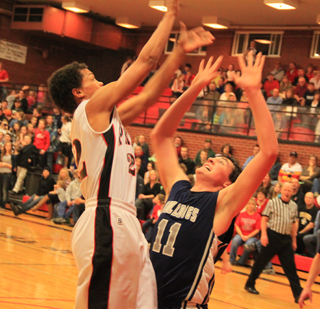Tyler Hankerson puts up a shot over a Grangeville defender.