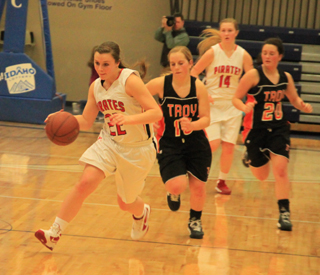 Brooke Schumacher heads downcourt after a steal against Troy. Trailing is Kayla Schumacher.