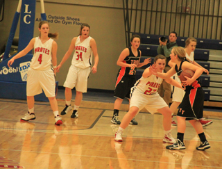 The Prairie Lady Pirates defense throttled Troy in the second half last Friday and then shut down Wallace on Saturday to earn the team a place in the state tournament. They forced 13 third quarter turnovers and 28 in the game from Troy and then 48 in the game against Wallace. Brooke Schumacher is shown guarding Troys leading scorer, Madison Yockey while from left Tanna Schlader, Shelby VonBargen and Kendall Schumacher work to keep the rest of the team in check.