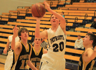 Josh Lustig shoots against Timberline. Michael Waters is in the background.