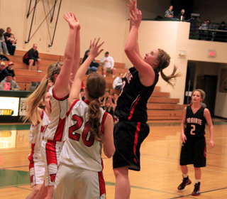 Kendall Schumacher got Prairie off to a hot start against Wallace with 12 first quarter points. At right is Callie Mader.