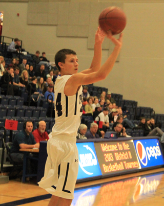 Michael Waters puts up a midrange jumper from out on the wing.