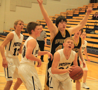 Nathan Beckman looks to put back an offensive rebound. Also shown from left are Shane Stubbers, Josh Lustig and Matthew Schwartz.