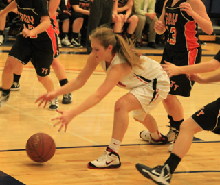 Tanna Schlader goes after a loose ball under the hoop against Troy.